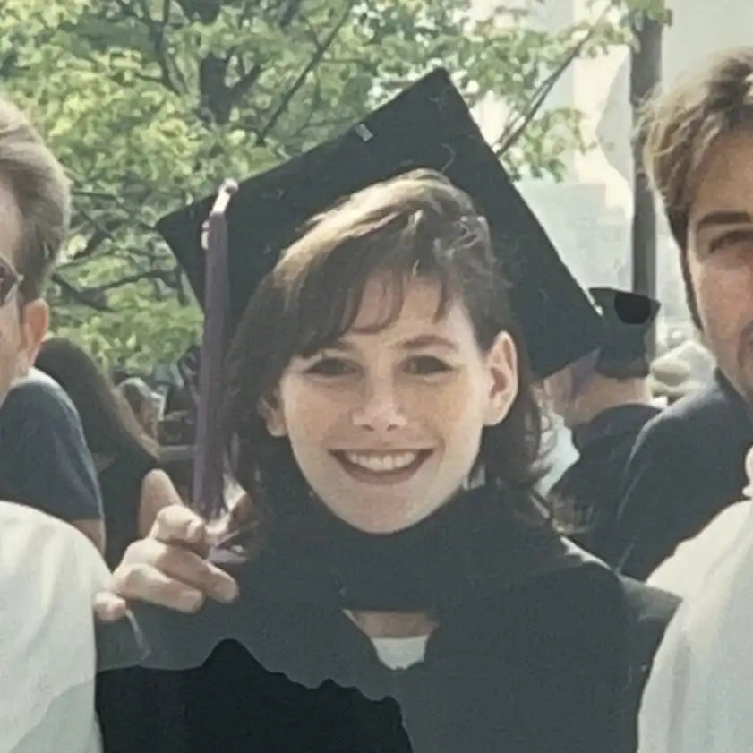Young Mara Smith in cap and gown.